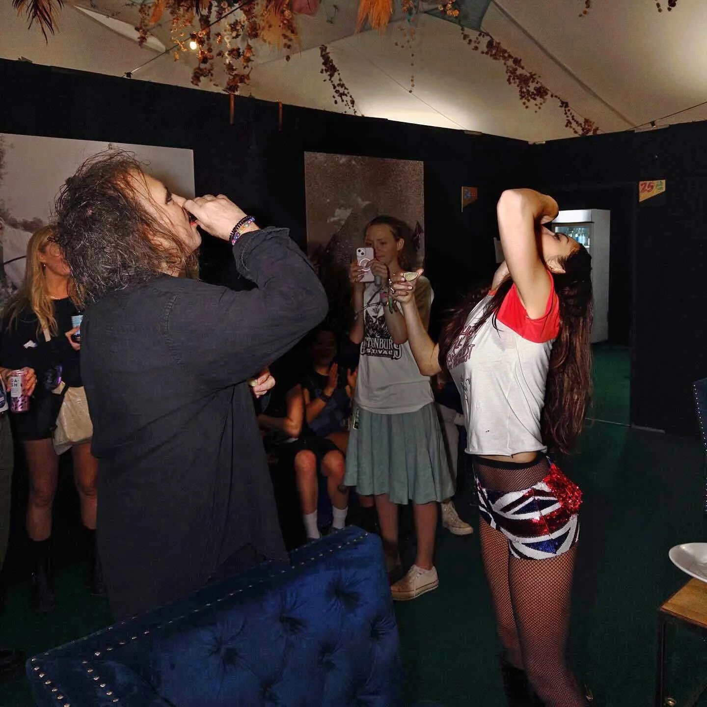 Olivia Rodrigo and Robert Smith (The Cure) doing shots. picture 1 of 1