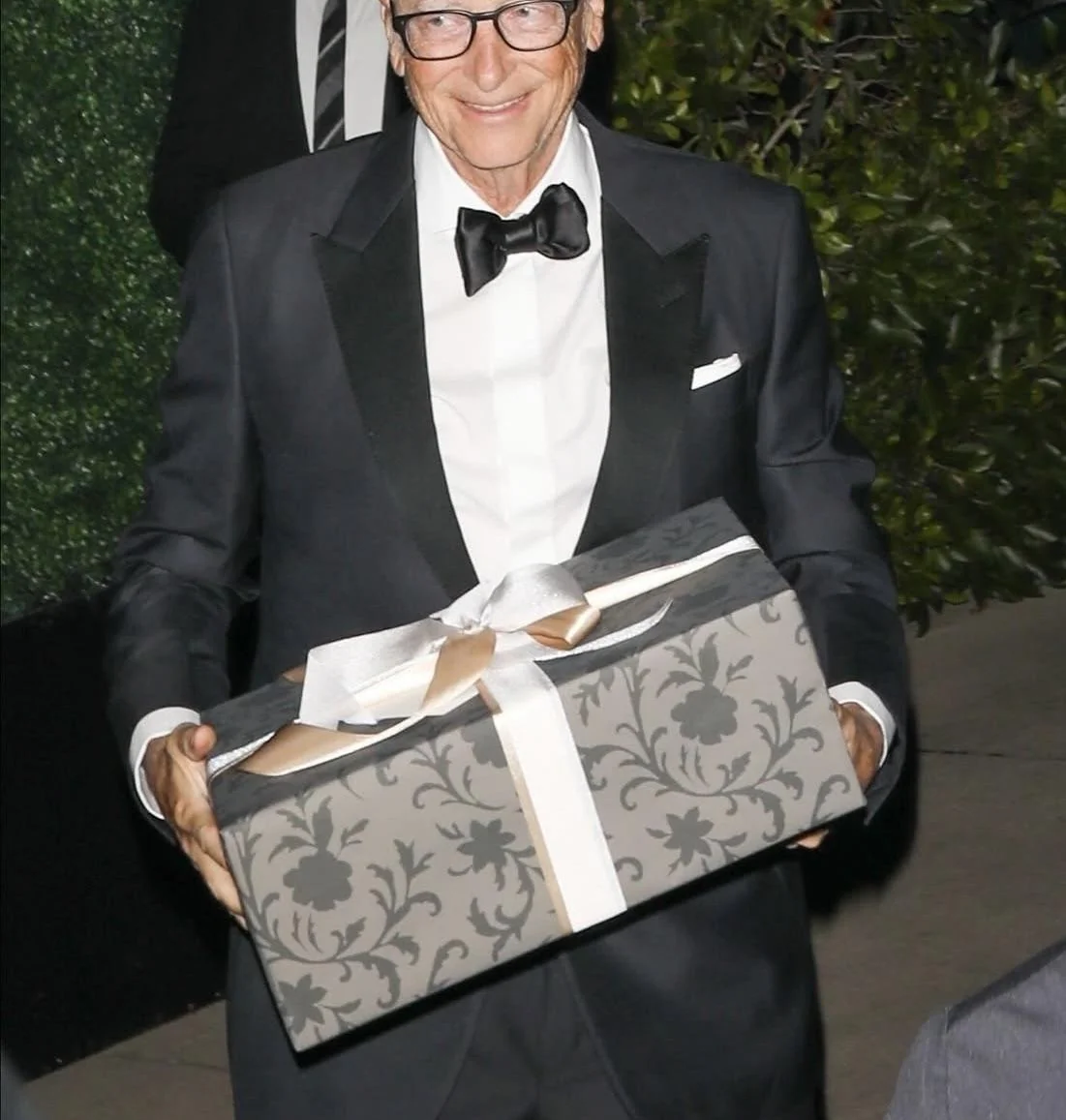 What's in the box Bill Gates gives to Kris Jenner at her 70th birthday party? picture 1 of 1
