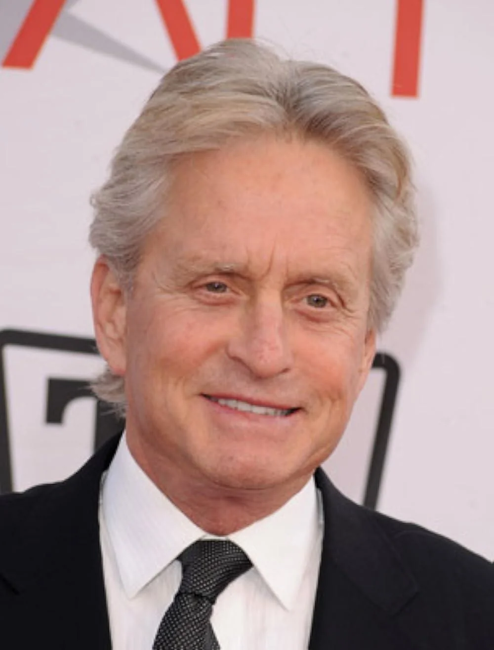 I noticed that Micheal Douglas kept the same hairstyle since the 70s picture 1 of 2