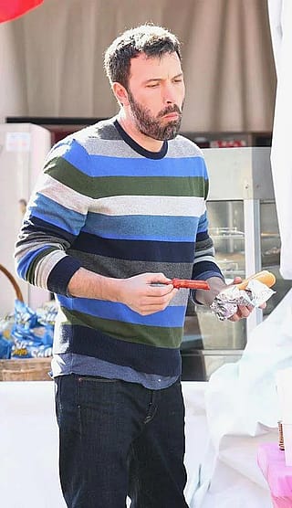 Ben Affleck eating a hotdog'